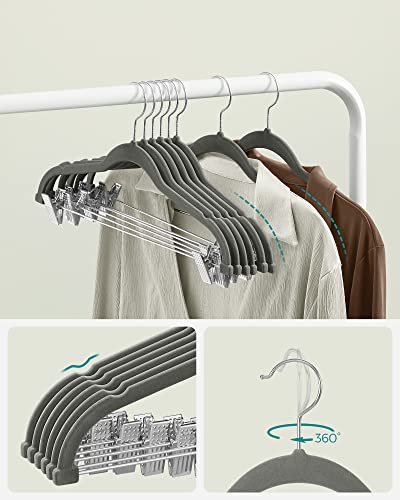 Image of SONGMICS Velvet Hangers with Clips, 12 Pack, 42.5 x 23.5 x 0.6 cm | Space Saving Hangers for Skirts and Trousers, Non-Slip, Adjustable Clips, Grey, BREANNA Collection CRF12V