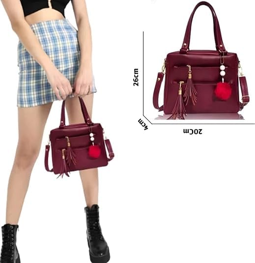 Image of Ladies Faux Leather Satchel Handbag, Burgundy, Double Zip Compartments, Tassel Charm, Pom Pom Accessory, Shoulder Strap