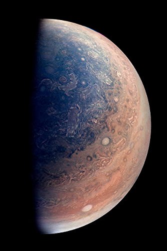 Enhanced color view of planet Jupiters south pole showing oval storms...