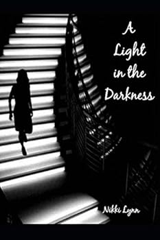 Paperback A Light in the Darkness Book