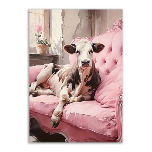 Cuadros decorativos de lienzo con vaca en sofá rosa para dar color al salón