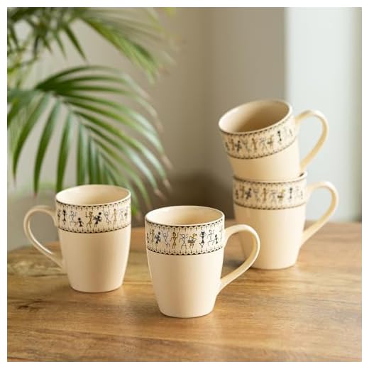 ExclusiveLane Ceramic Coffee Mugs Set of 4 | 'Whispers of Warli' Handcrafted Printed Mugs for Coffee Cup Tea Mug & Cup (Ivory White & Black, 300 ML, Microwave & Dishwasher Safe)