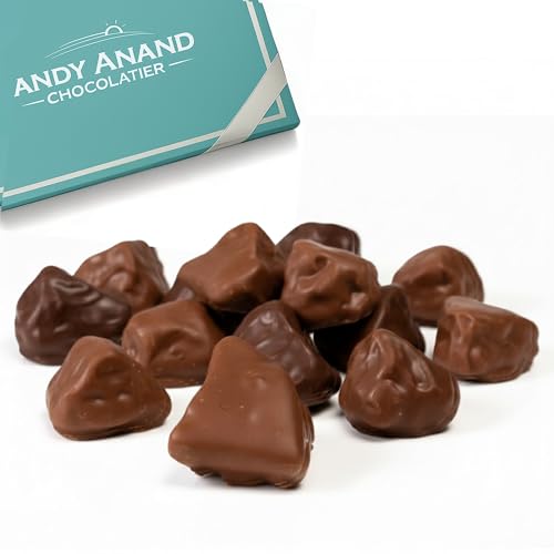 Chunks of chocolate-covered honeycomb candy stacked in a gift box
