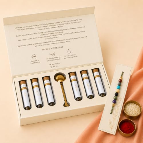 Image of OH CHA - NOOR Luxury Rakhi Gift Box for Brother | Contains 7 CHAKRA Rakhi (7 Stones), 6 Assorted Items in Borosilicate Glass Tubes - Chamomile Tea, Darjeeling Tea, Jaggery Powder, Almonds, Flavoured Saunf & Masala Raisins + Stainless Steel Infuser, Roli Chawal | rakhi gift hamper for brother | Rakshabandhan Gift