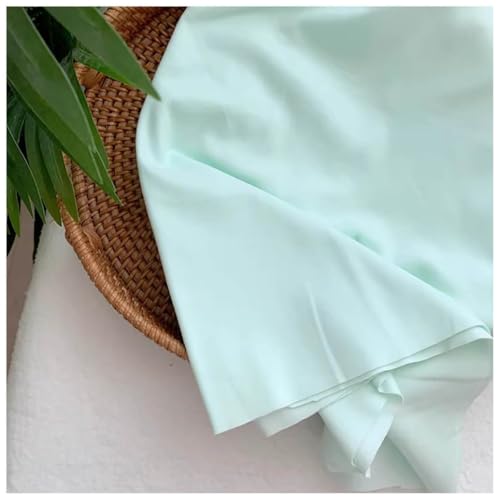 Tissu en coton uni vert anti-déformation pour vêtements et draps
