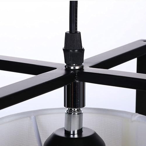 Lampe suspendue fer forgé pour optimiser l'éclairage d'une petite chambre