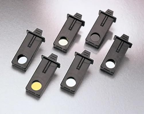 Image of six Hach Filter Assemblies, showing their black plastic housing and circular filter elements, some appearing white/silver and one yellow/gold.