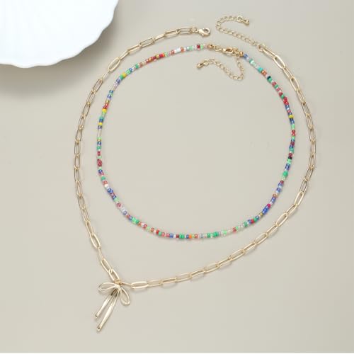 Collier ras du cou nœud doré et breloque marine au design unique