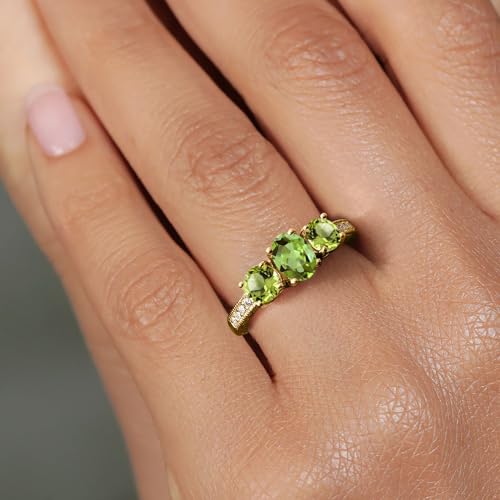 Gem Stone King 1.92 Cttw Green Peridot 18K Yellow Gold Plated Silver Ring | Gemstone Birthstone | Oval 7X5MM and Round 5MM | Available In Size 5, 6, 7, 8, 94