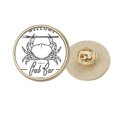 Broche marine pince crabe dorée pour égayer une veste unie