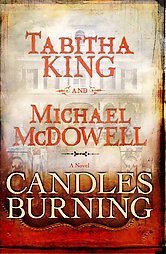 This book cover for Candles Burning by Tabitha King and Michael McDowell features a regal, historical red and cream color with a faded image of a historic Southern style home.