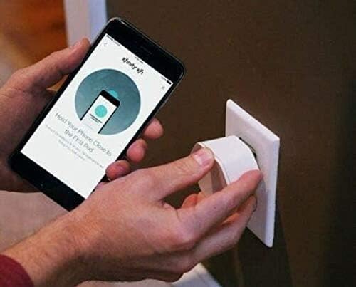 Person plugging in Xfinity xFi Pod