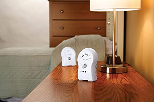 Safety 1st Crystal Clear Audio Monitor units placed on a wooden table in a room.