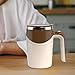 Auto -estirando la taza magnética automática Imagen de Auto -estirando la taza magnética automática