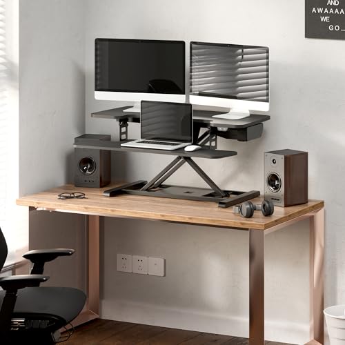 Image of FLEXISPOT 35 inch Electric Standing Desk Converter, Motorized Stand up Desk Riser, Monitor and Laptop Workstation with Wide Keyboard Tray, Black