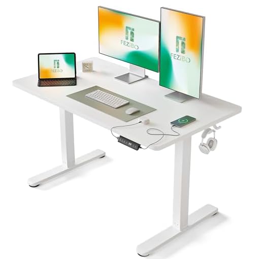 FEZIBO Bureau Assis Debout Électrique, 120 x 60 cmBureau Table Debout Réglable en Hauteur Acier T Pieds avec Système Anti-Collision, Panneau Contrôle à Fonctions Mémoires, Planche Blanc