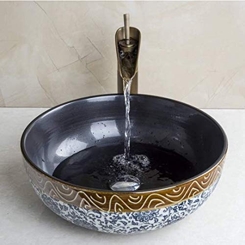 Lavabo céramique rond et robinet cascade pour éviter les éclaboussures