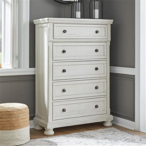 Image of Signature Design by Ashley Robbinsdale Tall Chest of Drawers, Antique White | 5 dovetail drawers, 58-in vertical profile, Select oak veneer, Engineered wood, Solid wood components, Cast resin components
