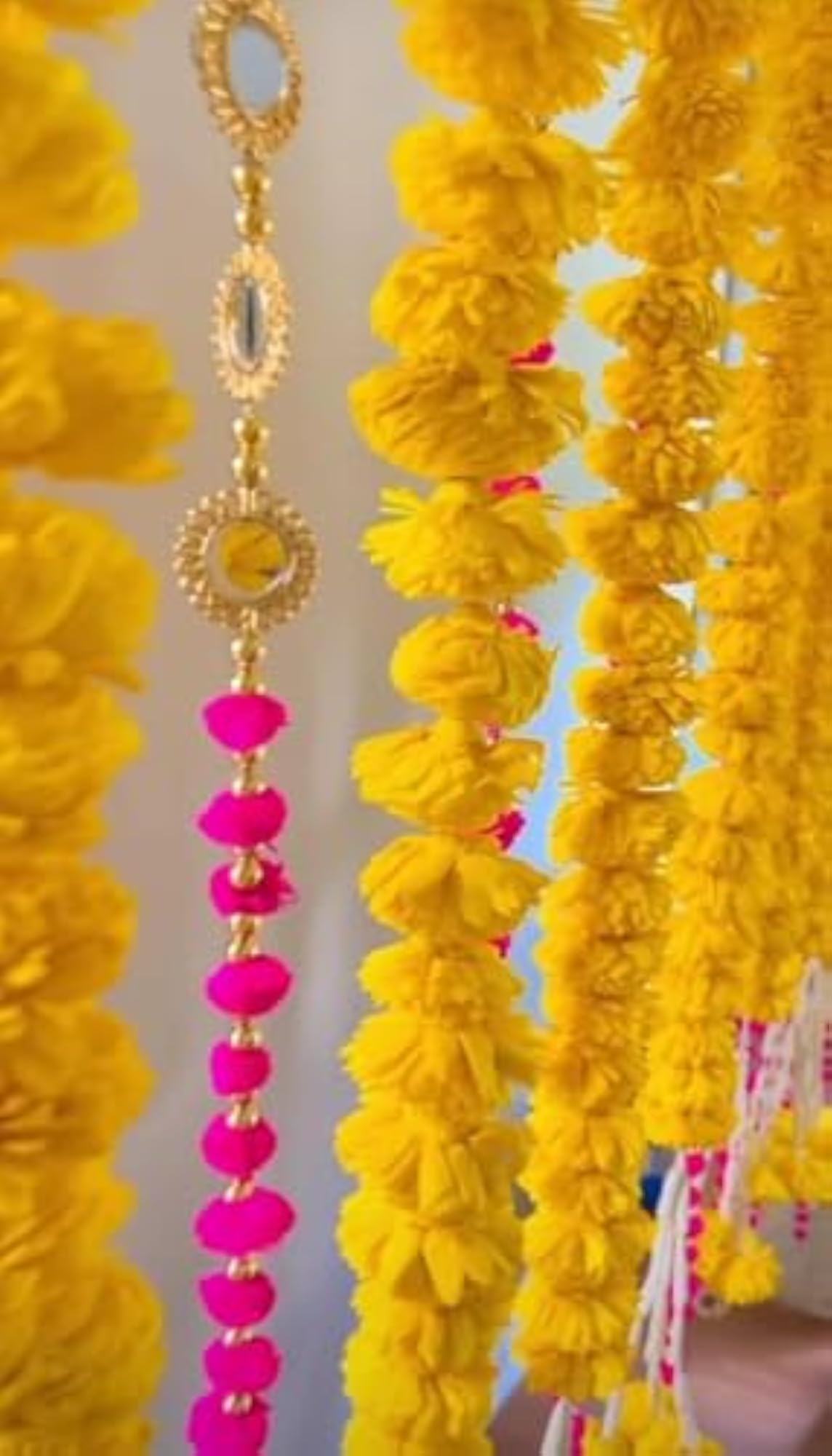 Decorative Ganpati Poojan Setup with Marigold Toran and Umbrellas
