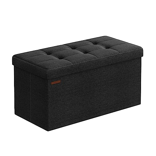 SONGMICS MAZIE Collection - Storage Ottoman Bench, 76 cm Folding Foot Rest Stool, End of Bed Bench, Easy Assembly, for Living Room, Bedroom, Entryway, Ink Black LSF047B51
