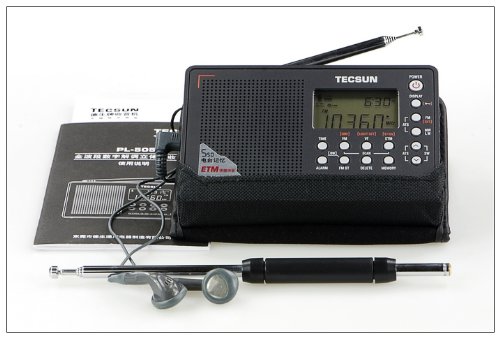 Tecsun PL-505 radio with included accessories: external antenna, earphones, and user manual.