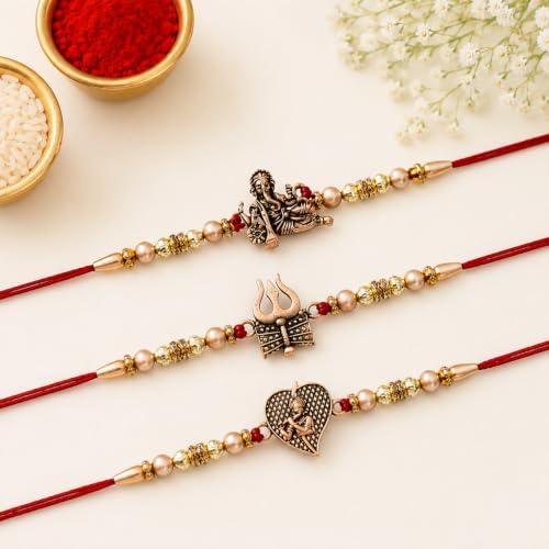 Image of eCraftIndia Red & Golden Set of 3 Trishul with Damru, Lord Ganesha, & Lord Krishna Playing Flute Religious Rakhis with Roli Chawal Pack