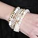 RIAH FASHION Coin Bead Multi Layer Versatile Statement Bracelets - Stackable Beaded Strand Stretch Bangles Sparkly Crystal, Tassel Charm (Natural)