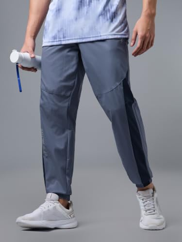 Image of TECHNOSPORT Men's Regular Fit Joggers with Zip Pockets, TECHNOLITE Quick Dry Stretchable Lightweight Track Pants for Gym Running and Casual Wear