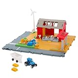Der Traktor im Maßstab 1:64 kann zur Weizenernte durch das Feld gefahren werden, um dann den Anhänger anzufügen und das Heu zur Scheune zu befördern.