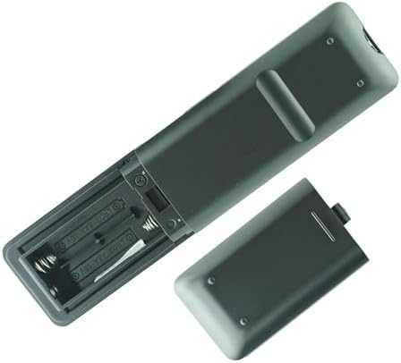 Remote control with battery cover open, showing battery compartment