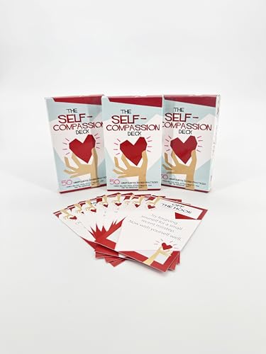 Self-compassion card decks with individual prompt cards arranged in front