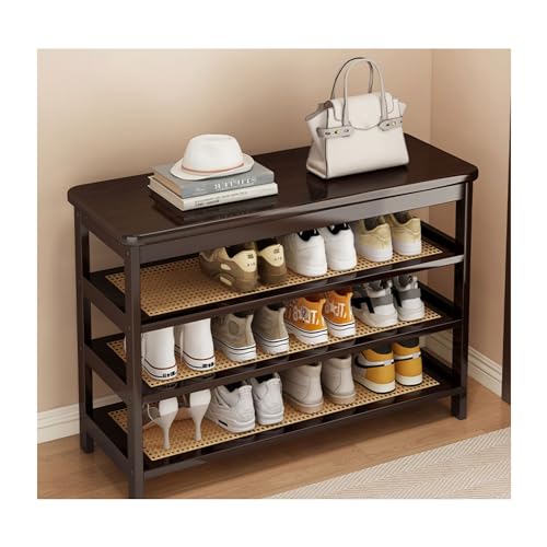 Banc à chaussures en bois pour optimiser une petite entrée encombrée par les affaires