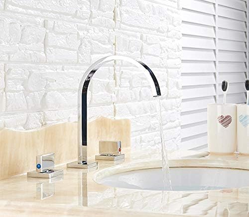 Robinets de lavabo en chrome poli de salle de bains montés sur le pont