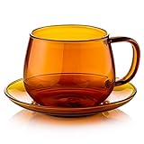 La taza de café y el platillo se pueden utilizar con máquinas de café. Hermosa vasos de cristal de colores