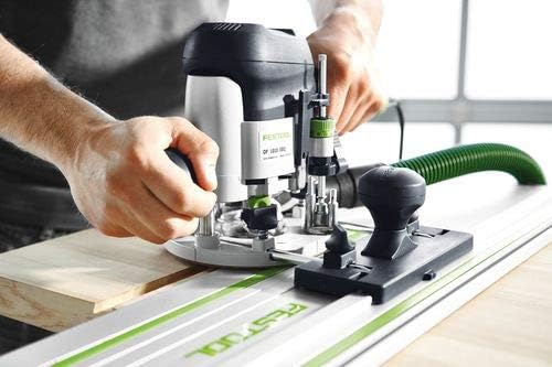User adjusting Festool OF 1010 EBQ router on a workpiece
