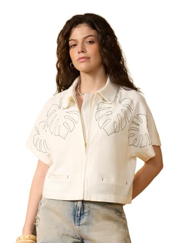 Chemise blanche légère surdimensionnée pour masquer les complexes et rester au frais