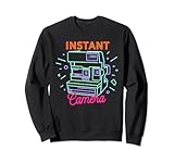 Este divertido diseño estético de vaporwave lee la cámara instantánea.