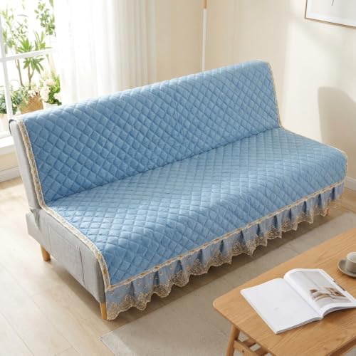 Housse de canapé bleu matelassée pour créer un salon chaleureux et accueillant