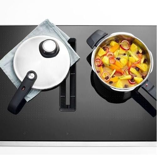 Top-down view of Fissler pressure cooker with food