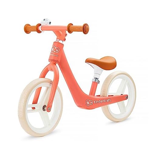 Kinderkraft Balanscykel FLY PLUS, lätt cykel, inga pedaler, 12 tum hjul, med justerbar sadel, retro-stil, magnesiumram, för småbarn, barn, från 3 år till 35 kg, korall