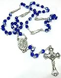 Cruz con figura y medalla de Lourdes.