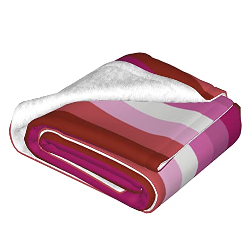 Couverture arc-en-ciel en peluche pour cocooning sur le canapé