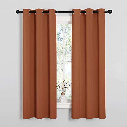 Image of NICETOWN Blackout Curtain Panels for Girls Room, Nursery Essential Thermal Insulated Solid Grommet Top Blackout Drapes (Burnt Orange, 1 Pair, 34 x 63 Inch)