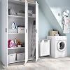 Open white multi-purpose cabinet with various household items neatly stored on shelves, including cleaning supplies, an iron, and folded linens.