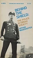 Behind the Shield: The Police in Urban Society 0385061285 Book Cover