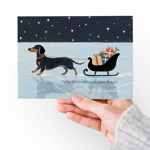 Witzige Dackel Weihnachtskarte – originelle Klappkarte Frohe Weihnachten & guten Rutsch, Hund mit Schlitten, inkl. Umschlag & weißem Einleger