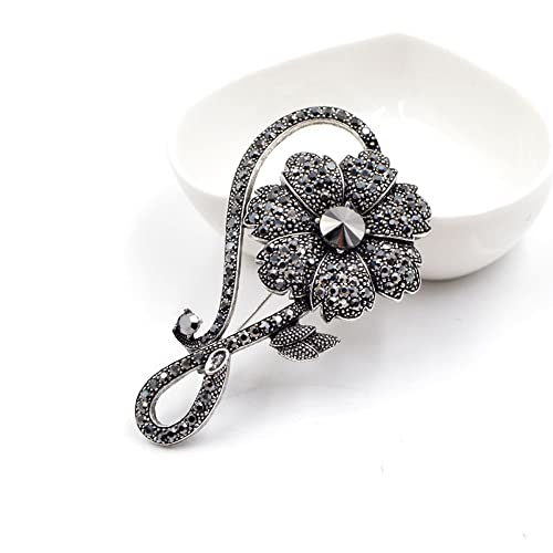 Grande broche fleur noire vintage en strass idéale pour sublimer un manteau chic en soirée