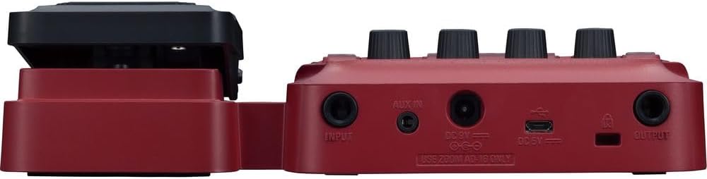 پاسي view of the Zoom B1X Four pedal, showing input, output, AUX IN, and power ports