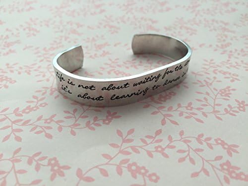 Hand Stamped Cuff, "Life is not about waiting for the storm to pass, it’s about learning to dance in the rain" with storm/ lightening, umbrella and music note design