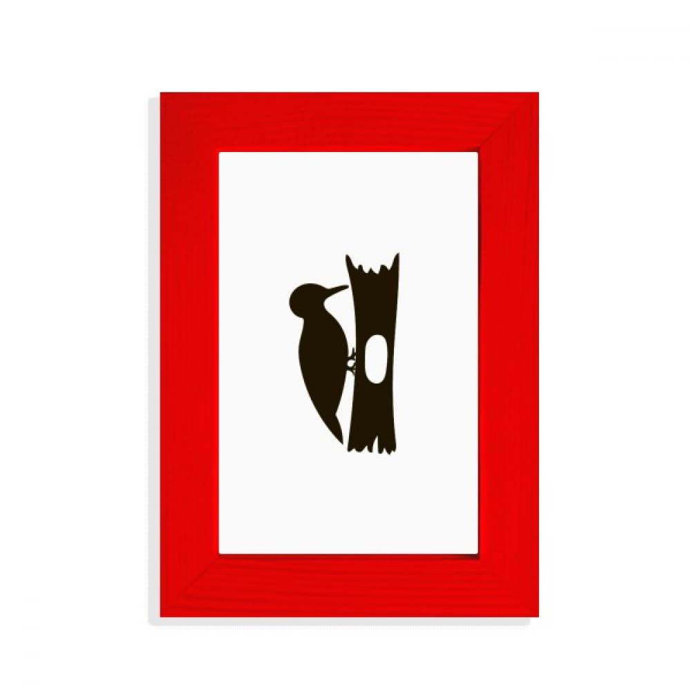 Cadre photo rouge original et sculpture animal en bois noir de décoration